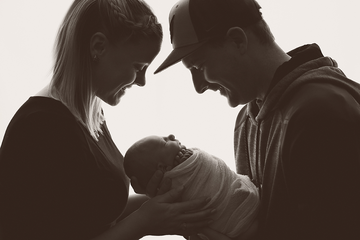 Newborn baby with parents - lifestyle newborn Nutter photographer