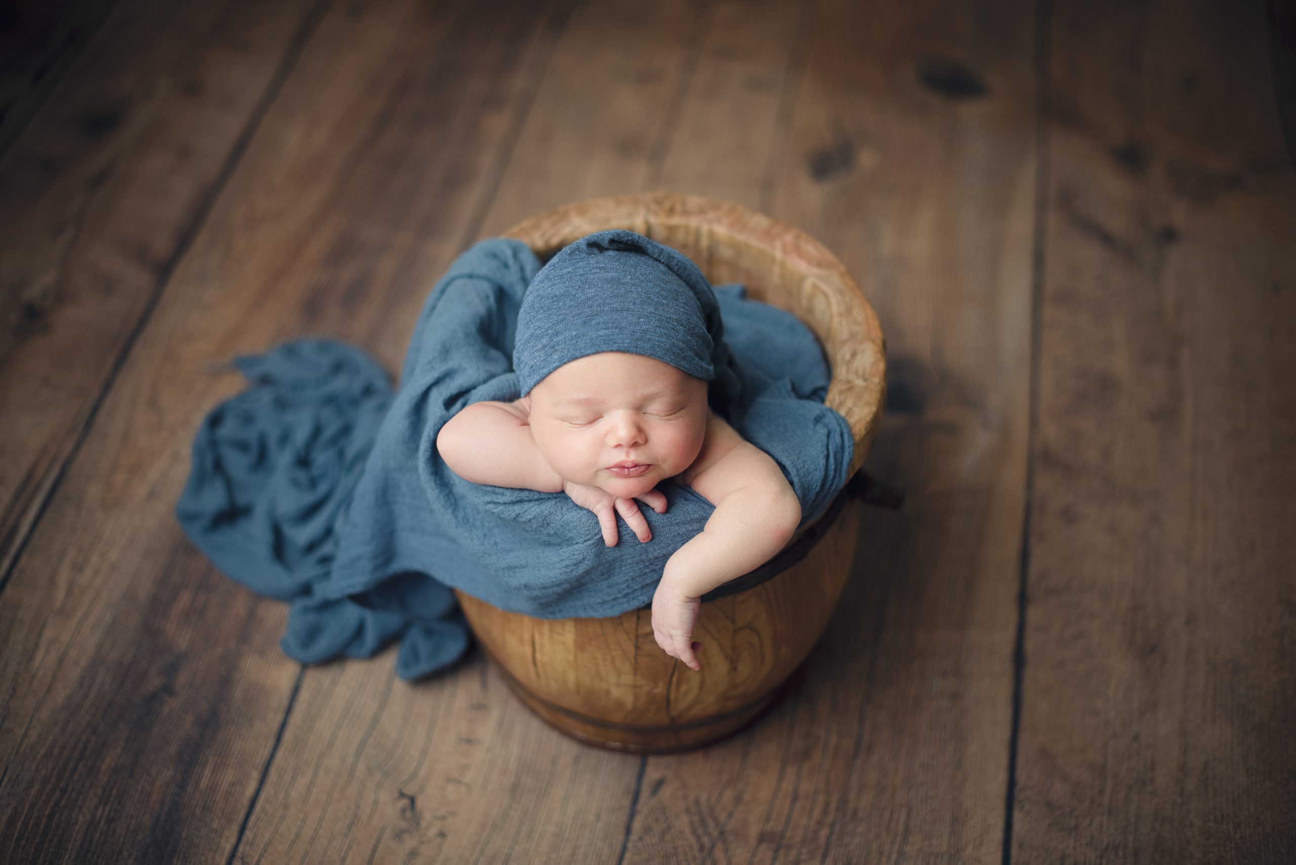 Adorable baby boy in a honey bucket - Nutter Photography